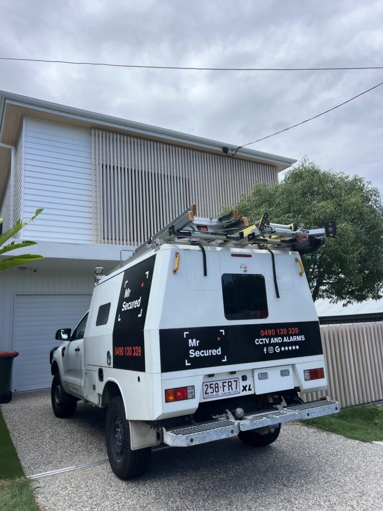 Mr Secured van on site at a modern double-storey home
