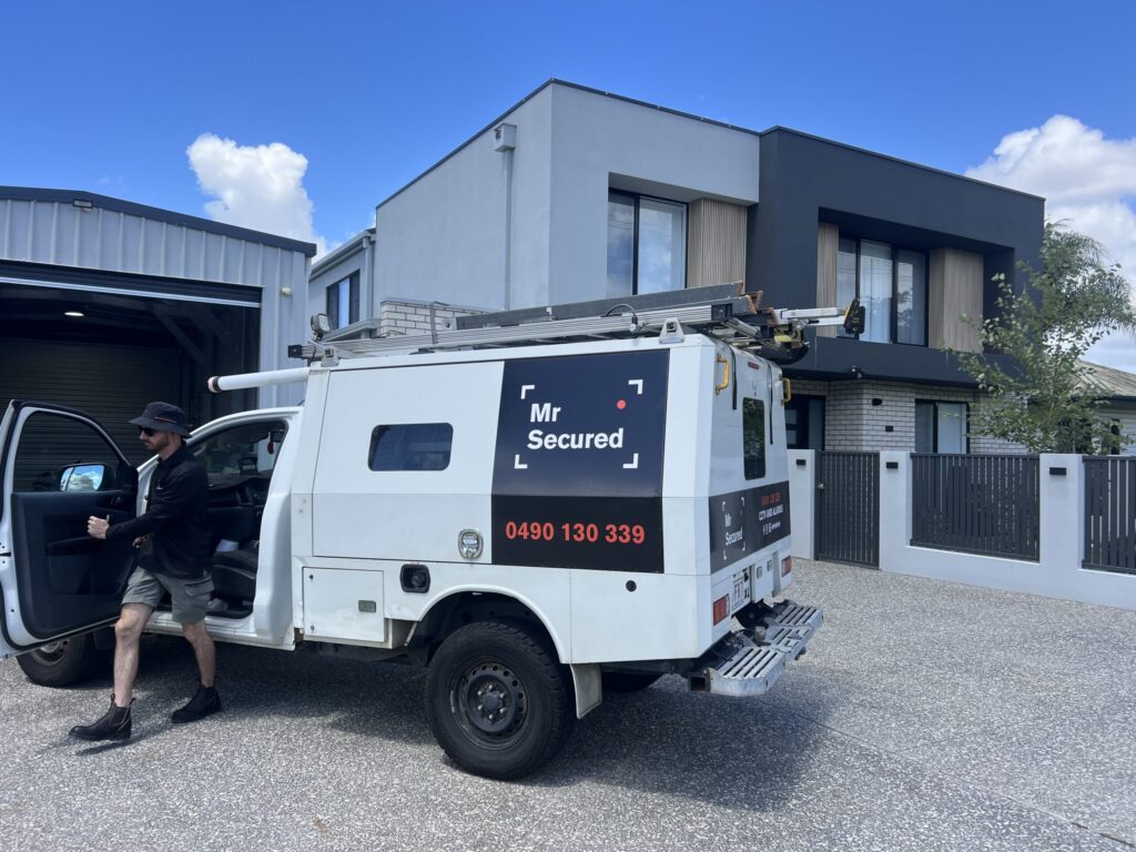 Mr Secured van on site at a modern two-storey home